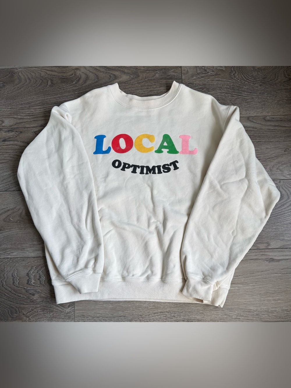 74.  Madhappy Local Optimist Multicolor Graphic Crewneck Sweatshirt Cream Small